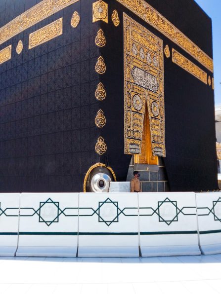 Pilgrims in Kaaba in Macca al Haram - umrah Covid 19 coronavirus restrictions face mask